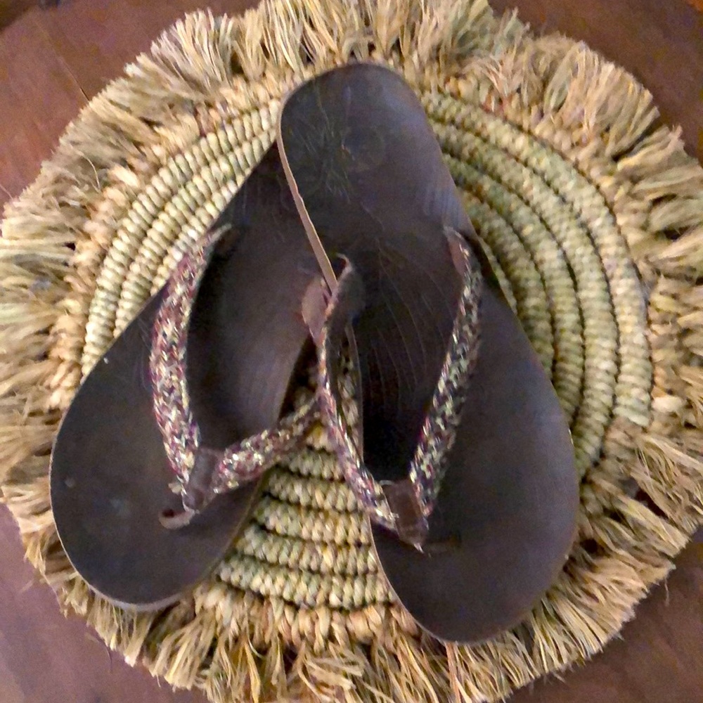 Brown braided flip flops